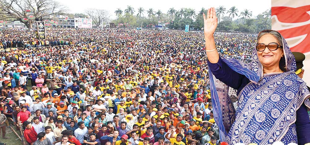 Prime Minister Sheikh Hasina waving at a public meeting at Madrasa ground in Rajshahi city on Thursday.	Photo: BSS