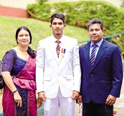 Hasitha Bayagoda along with his parents. 