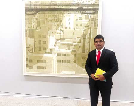 Anisuzzaman in front of his woodcut print