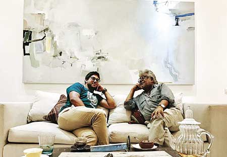 The artist with his only son in front of his painting