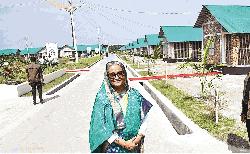 Affected villagers receive house keys, registration papers from PM