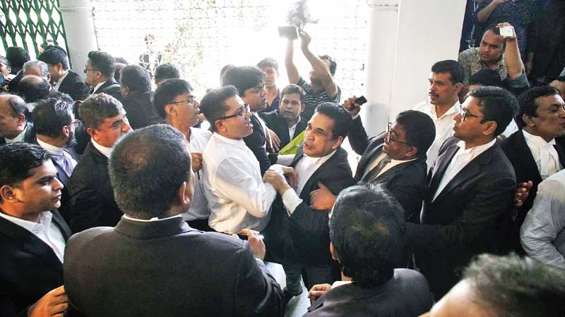 Pro-BNP lawyers locked in a scuffle with pro-AL lawyers on Supreme Court premises on Wednesday while pro -BNP lawyers boycotting the court protesting the increased punishment of BNP Chairperson Khaleda Zia in Zia Orphanage Trust graft case.	photo: Observer