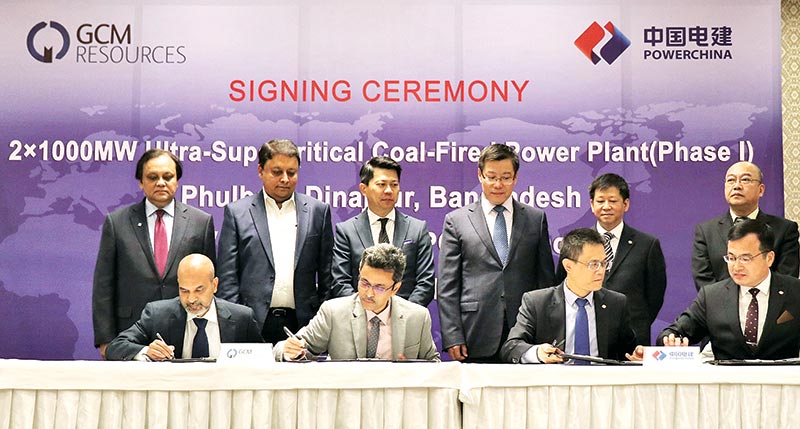 GCM Resources' Md. Badruzzaman and Md. Firoz Zaman and PowerChina International's Xiong Li Xin and Pan Deng Yu signing agreements and contracts on behalf of their respective sides, while GCM Executive Chairman Datuk Michael Tang PJN, Dipon Group Managing Director Engr. Rashed Mahmud, Mutual Trust Bank Managing Director Anis Khan, PowerChina International Chairman Ding Zheng Guo, Chinese Chamber of Commerce Bangladesh Chairman Lin Wei Qiang and PowerChina Eurasia Vice President Xu Jiang witnessing the signing standing behind at the Radisson Blu Water Garden Dhaka hotel late on Thursday. 