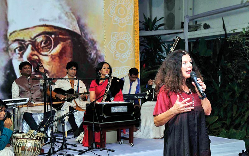 Shusmita Anis (behind) performs at the event