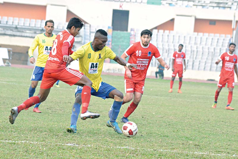 Both Sheikh Jamal Dhanmondi Club and Sheikh Russel Krira Chakra players trying to take control over the ball during their Bangladesh Premier League match at the Bangabandhu National Stadium in Dhaka on Sunday. 	photo: BFF 