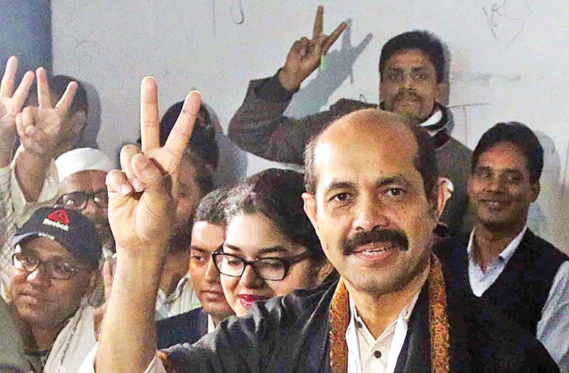 Awami League nominated DNCC mayoral candidate Atiqul Islam shows a V-sign after casting his vote.	photo: Observer