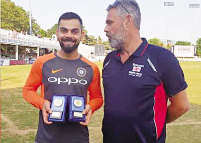 Virat Kohli presented with cricketer of the year award by Barmy Army.