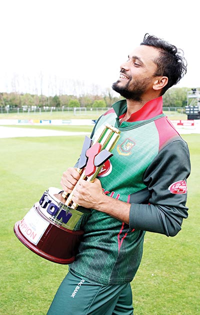 Bangladesh's captain Mashrafe Mortaza holds the winner's trophy after the one-day international Tri-Nation Series final between Bangladesh and West Indies at the Malahide cricket club, in Dublin on May 17, 2019.	photo: AFP 