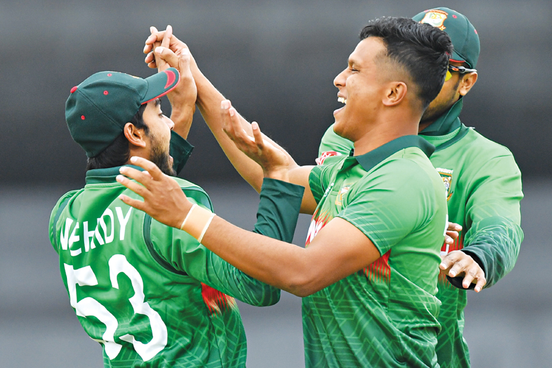 Bangladesh's Mohammad Saifuddin (R) celebrates taking the wicket of West Indies' Chris Gayle for 0 runs during the 2019 Cricket World Cup group stage match between West Indies and Bangladesh at The County Ground in Taunton, southwest England, on June 17, 2019.	photo: AFP 