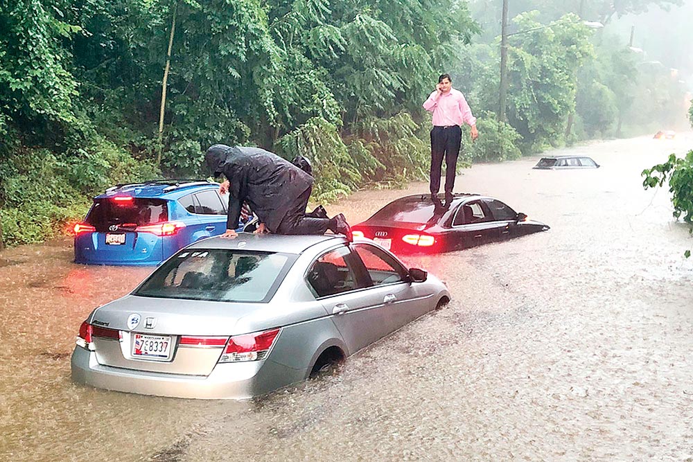 Motorists are stranded on a flooded section of Canal Road in Washington during a heavy rainstorm on July 8.	 �Photo: AP