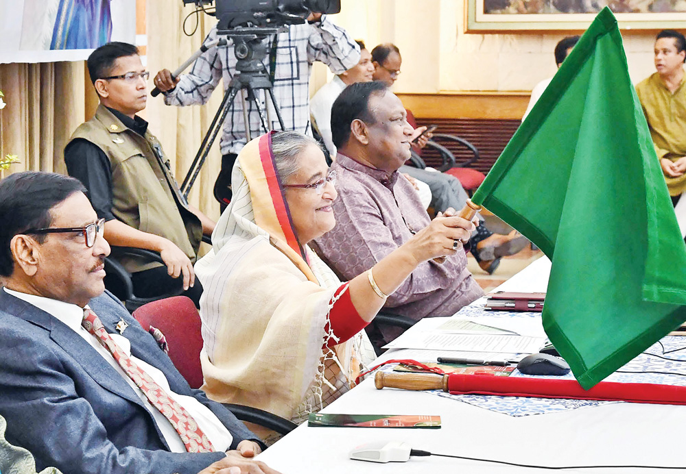 Prime Minister Sheikh Hasina flagging off the intercity train 'Kurigram Express' on the Kurigram-Dhaka-Kurigram route and launching newly-imported coaches of Rangpur Express and Lalmoni Express through a videoconferencing from her official residence Ganabhaban on Wednesday. photo : pid