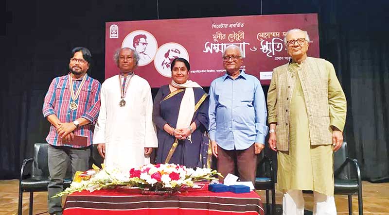 Awardees pose for a photo with the guests at the programme