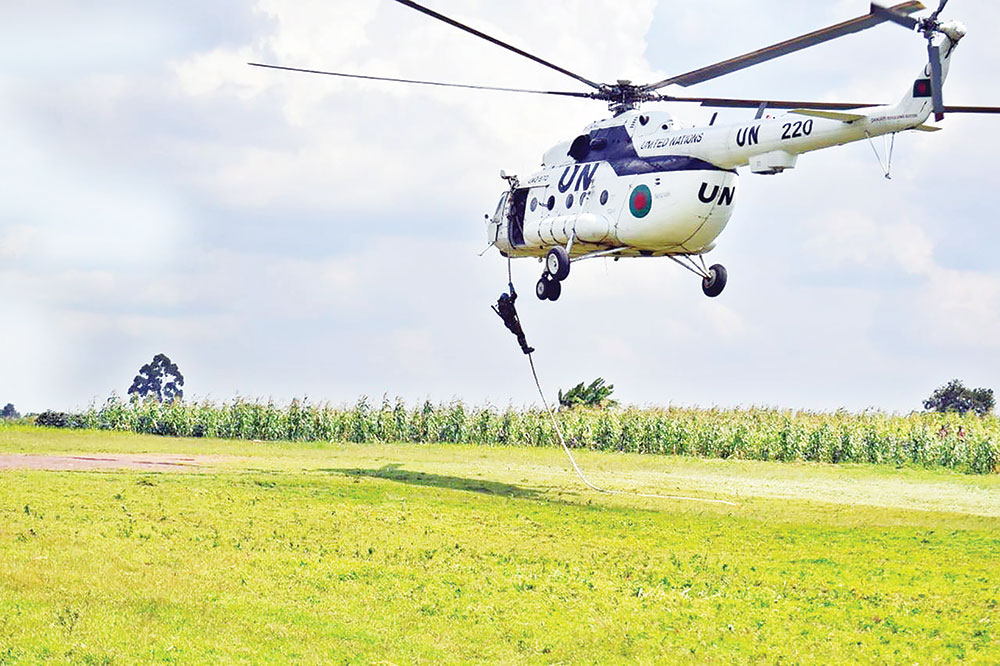 Bangladesh army commandos in UN peacekeeping mission rehearsing rappeling from an airborne helicopter somewhere in the war-ravaged Democratic Republic of Congo.	photo : Observer 