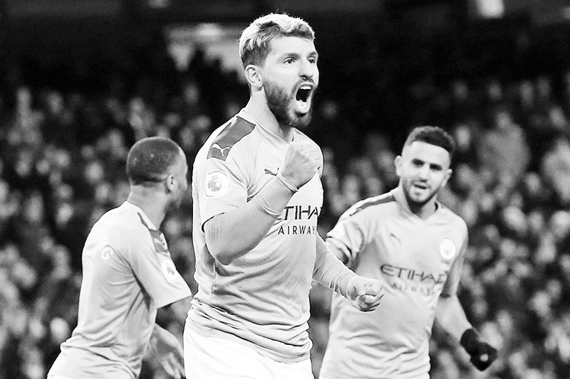 Manchester City's Argentinian striker Sergio Aguero (C) celebrates scoring the opening goal during the English Premier League football match between Manchester City and Sheffield United at the Etihad Stadium in Manchester, north west England, on December 29, 2019.	photo: AFP 