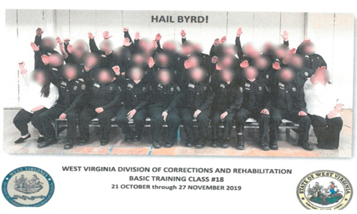 An investigation concluded that "ignorance" and an "appalling lack of judgment" motivated the Nazi salute in this group photo: AFP
