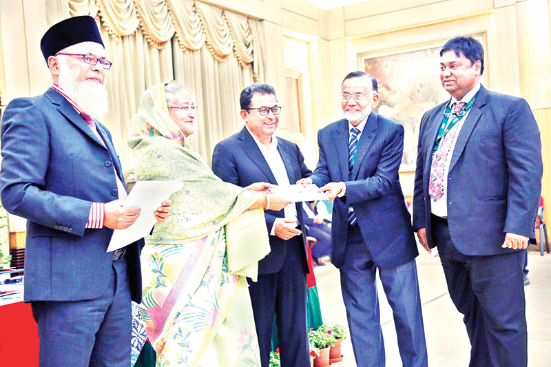 Prime Minister Sheikh Hasina received donation cheques from a number of banks on behalf of Bangabandhu Memorial Trust at her official residence Ganabhaban on Monday, ahead of the the 100th birth anniversary of Bangabandhu Sheikh Mujibur Rahman.