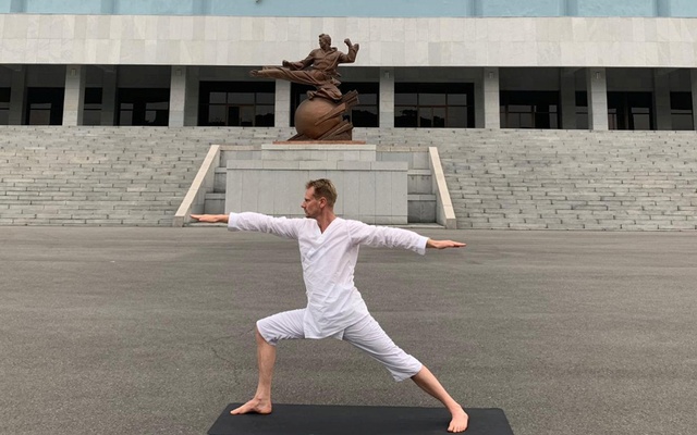 Swedish Ambassador Joachim Bergstrom practices yoga near the Taekwondo Palace in Pyongyang, North Korea. Photo: Reuters