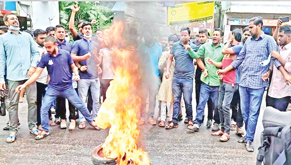 Sylhet MC College students stage a demonstration in front of the college on Saturday protesting the rape of a woman at the dormitory of the college on Friday night.	PHOTO: OBSERVER