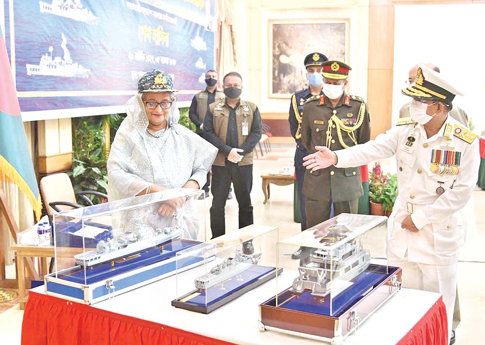 Prime Minister Sheikh Hasina inspecting replica of five modern ships of Bangladesh Navy - three warships and two survey ships - after commissioning them through a videoconference from her official residence Ganobhaban in the  capital on Thursday. 	PHOTO: PID