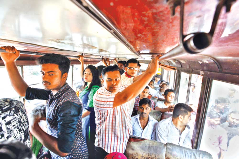 No social distancing is maintained, while many passengers are without masks as they are standing on a passenger bus at Gulistan in the capital on Tuesday.	PHOTO: OBSERVER