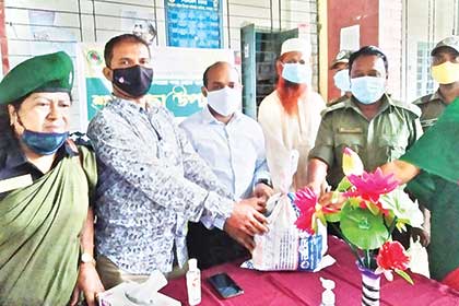 Food assistance was given to the destitute people in Sapahar Upazila on Tuesday (L) and new clothes distributed among orphan madrasa students in Patnitala Upazila of Naogaon on Monday on the occasion of the Eid-ul-Fitr.	photoS: observer
