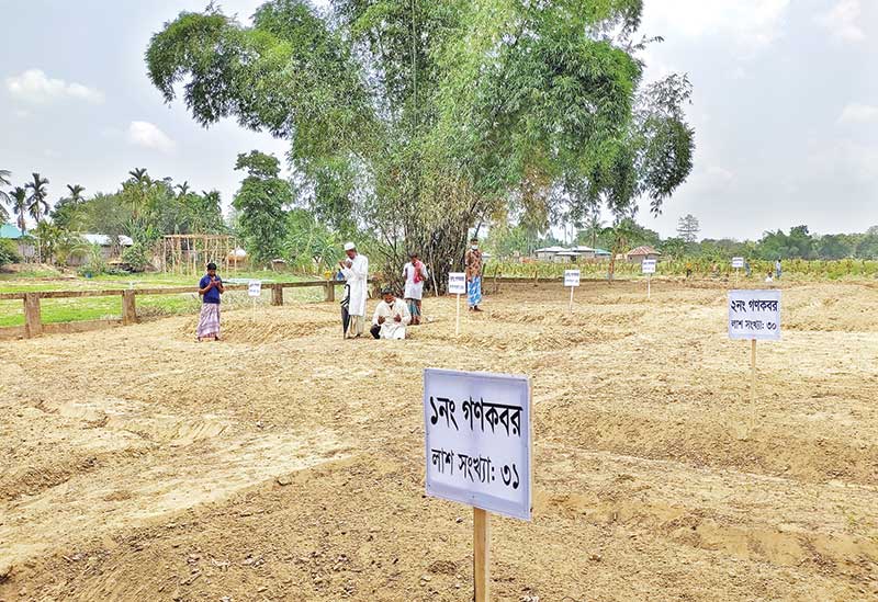 Relatives offer prayers on Monday for victims of brutal genocide occurred on May 31 in 1984 at Bhushanchhara area of Barkal upazila in Rangamati district.	photo: observer