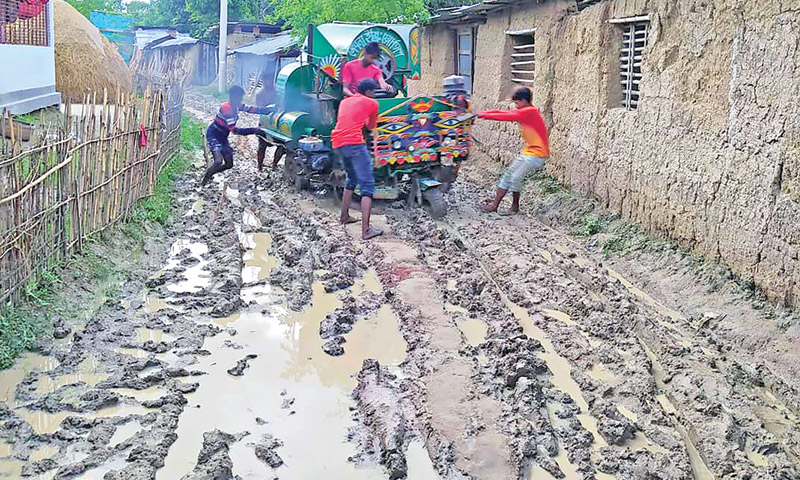 The photo shows the  mud road ranging from Nayapara to Shibsamudra in Kalai Upazila.	photo: observer