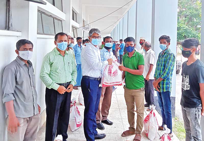 Feni DC Abu Selim Mahmud-ul Hasan distributed food items among 40 hawkers in the town on Tuesday.	photo: observer