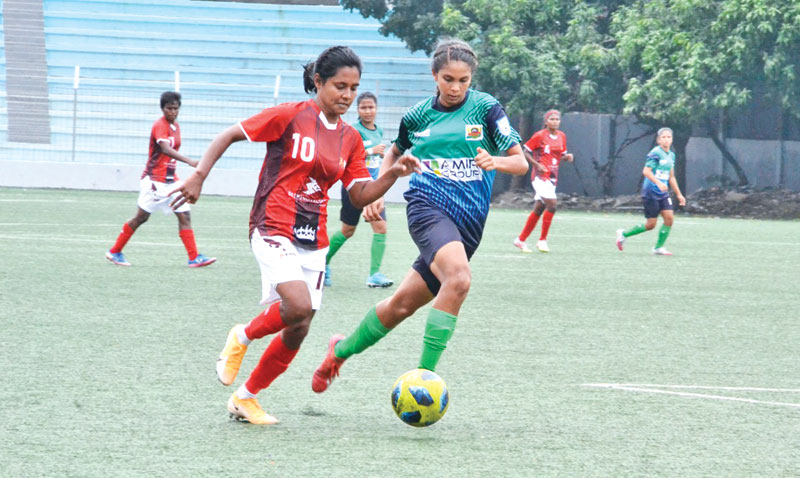 A moment of the match between Bashundhara Kings and Ataur Rahman Bhuiyan College in the Women's Football League at Shaheed Birshreshtha Sepoy Mustafa Kamal Stadium, Kamalapur in Dhaka on Tuesday.