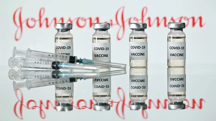 An illustration picture shows vials with Covid-19 vaccine stickers attached and syringes with the logo of US pharmaceutical company Johnson & Johnson. File photo: AFP
