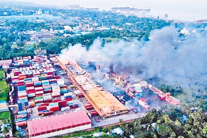 An arial view of the inferno at BM Container Depot in Sitakunda upazila of Chattogram. (inset) Members of the Army join the firefighting efforts on Sunday. 	PHOTO: OBSERVER