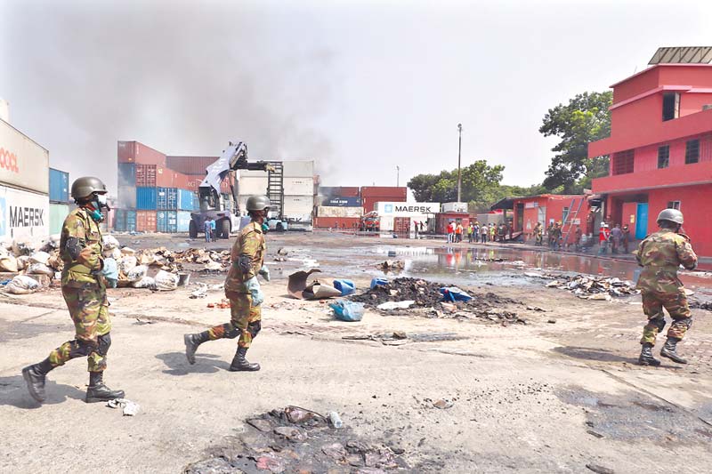 An arial view of the inferno at BM Container Depot in Sitakunda upazila of Chattogram. (inset) Members of the Army join the firefighting efforts on Sunday. 	PHOTO: OBSERVER