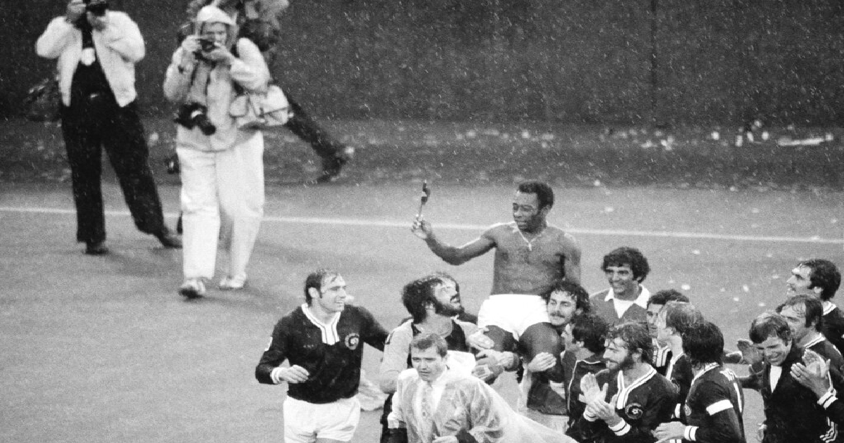 Pele is carried off the Giants Stadium field by his New York Cosmos teammates after his final soccer game, in East Rutherford, New Jersey, Oct. 1, 1977. Smiling and looking up at Pele are Giorgio Chinaglia of Italy and Erol Yasin of Turkey, center. Pel&eacute;, the Brazilian king of soccer who won a record three World Cups and became one of the most commanding sports figures of the last century, died in Sao Paulo on Thursday, Dec. 29, 2022. He was 82.
