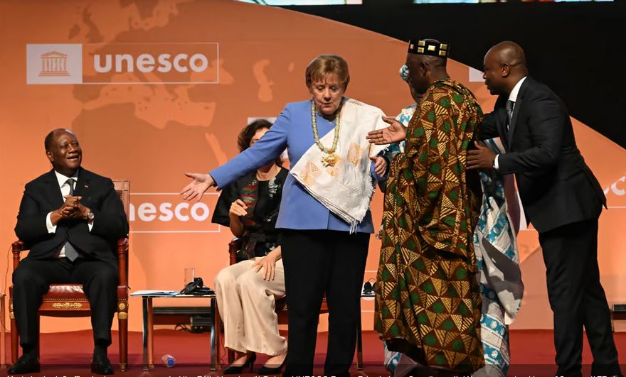 Caption: Merkel, who left office last year, was awarded the F&eacute;lix Houphouët-Boigny UNESCO Peace Prize in Ivory Coast's capital Yamoussoukro | Issouf Sanogo/AFP via Getty Images 