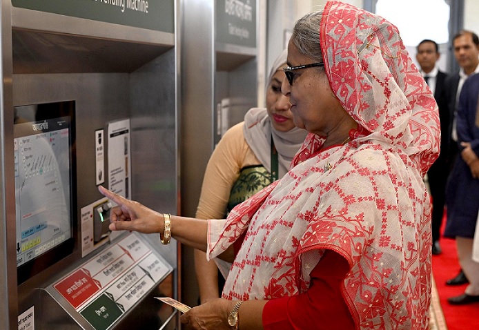 Prime Minister Sheikh Hasina on Saturday afternoon buys Metro Rail's ticket from the ticket vending machine at Agargaon Station. Then she traveled to Motijheel from Agargaon Station to mark the operation of the section.