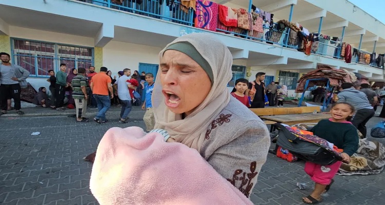 Palestinians react following an attack on a UN-run school sheltering displaced people in the Jabalia refugee camp in the northern Gaza Strip, on November 4, 2023 [File Anas al-Shareef/Reuters]