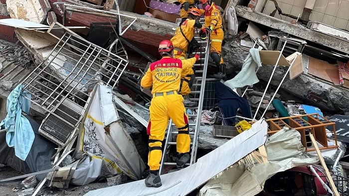 Firefighters work at the site where a building collapsed following the earthquake, in Hualien, Taiwan, in this handout provided by Taiwan's National Fire Agency on April 3, 2024. (Reuters)