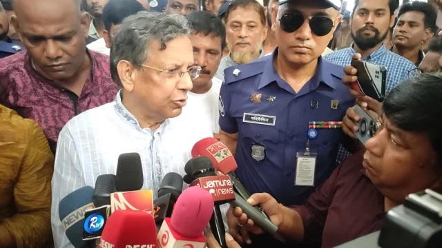 Law Minister Anisul Huq speaks to journalists at Akhaura railway station in Brahmanbaria on Friday morning