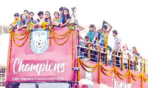 Unstoppable women return home, ride open-top bus