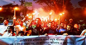 Sylhet tea workers demand unpaid wages with torch procession
