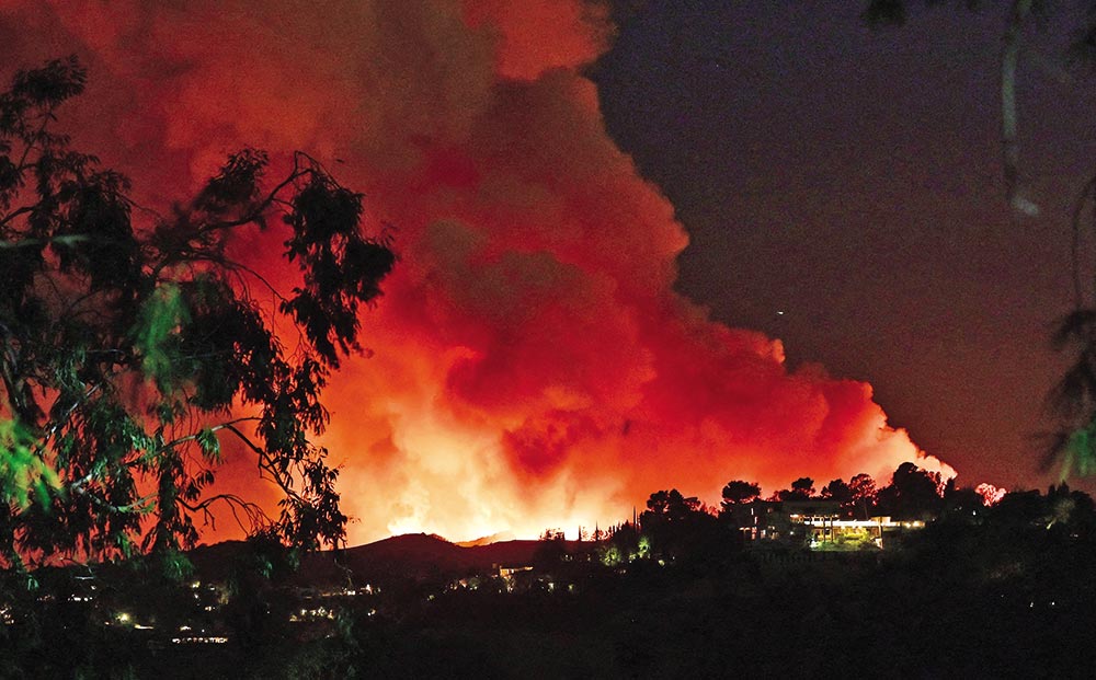 Big Los Angeles wildfire switches direction, posing new threat despite ...