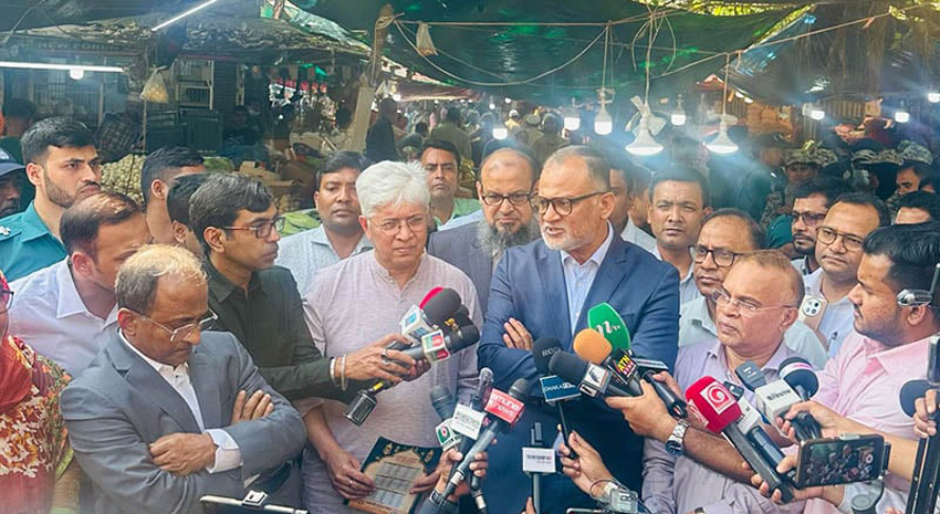 Commerce Adviser Sheikh Bashir Uddin spoke with journalists after visiting the Mohammadpur Town Hall Raw Market in the city Monday. Photo: PID