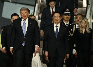 Trump lands in China for Xi summit 