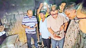 Health minister tastes patients' food during hospital inspection 