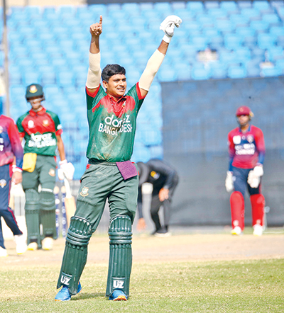 Bangladesh Under-19 team's opening batsman Mahfijul Islam celebrates his century against Kuwait Under-19 team on Saturday at Sharjah Cricket Stadium in the UAE. photo: ACC