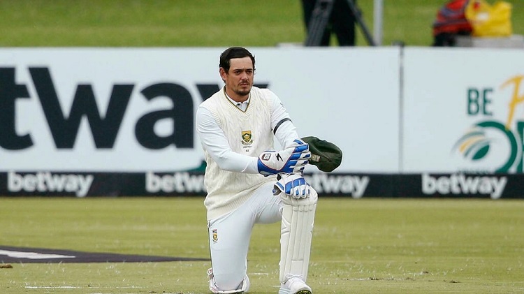 Quinton de Kock takes a knee ahead of the start of the first day of this month's first Test with India. Photo: AFP
