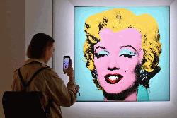 Warhol’s Marilyn portrait sells for world record $195m