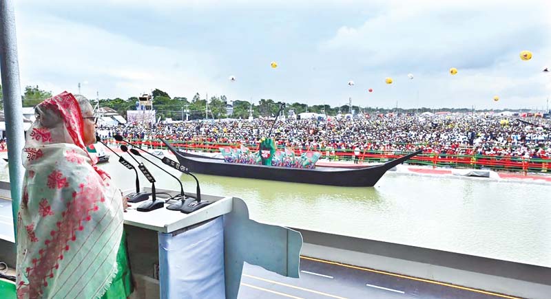 Prime Minister Sheikh Hasina speaking at a public rally organised by the Awami League, at Kathalbari under         Shibchar Upazila in Madaripur on the bank of the Padma River marking the opening of the much-awaited Padma      Bridge on Saturday.  	photo : pmo