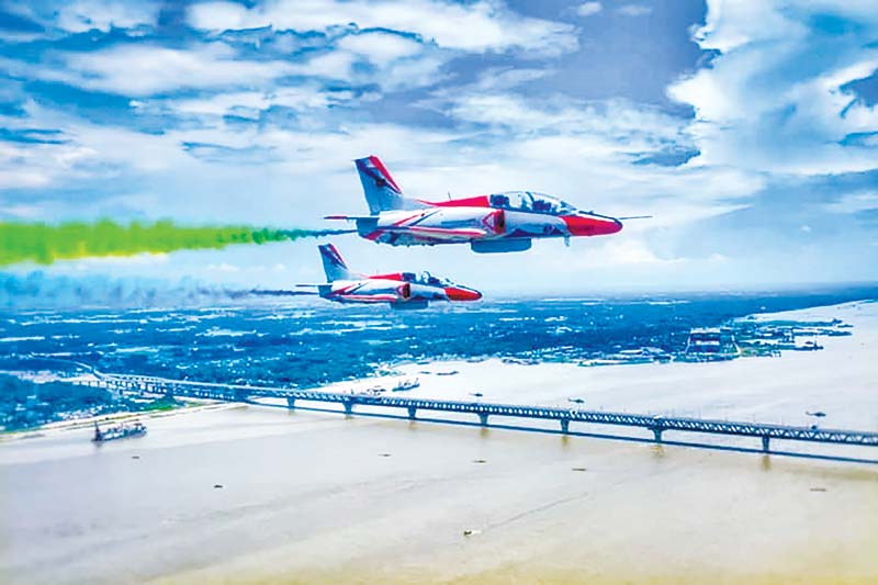 Bangladesh Air Force displayed a spectacular fly-past and aerobatic show to mark the historic inauguration of the Padma Bridge on Saturday. 	photo : ISPR