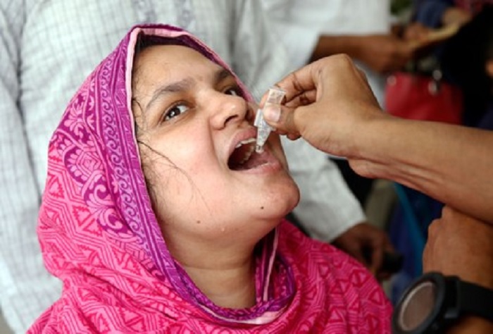 A Bangladeshi woman receives oral cholera vaccine 